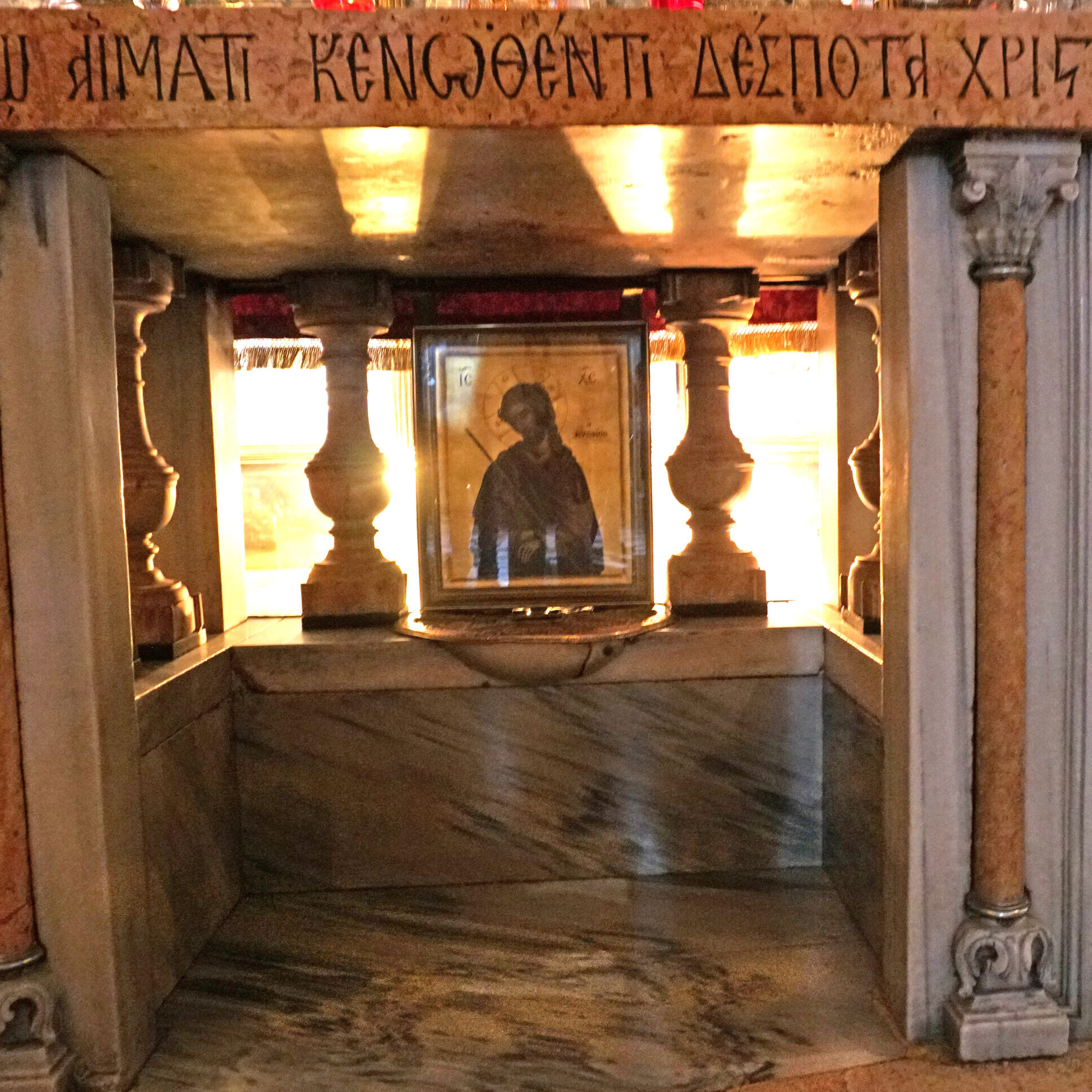 The Altar of the Crucifixion at the Church of the Holy Sepulchre in Jerusalem. The Rock of Calvary is seen encased in glass.


Photograph by Dennis Brack